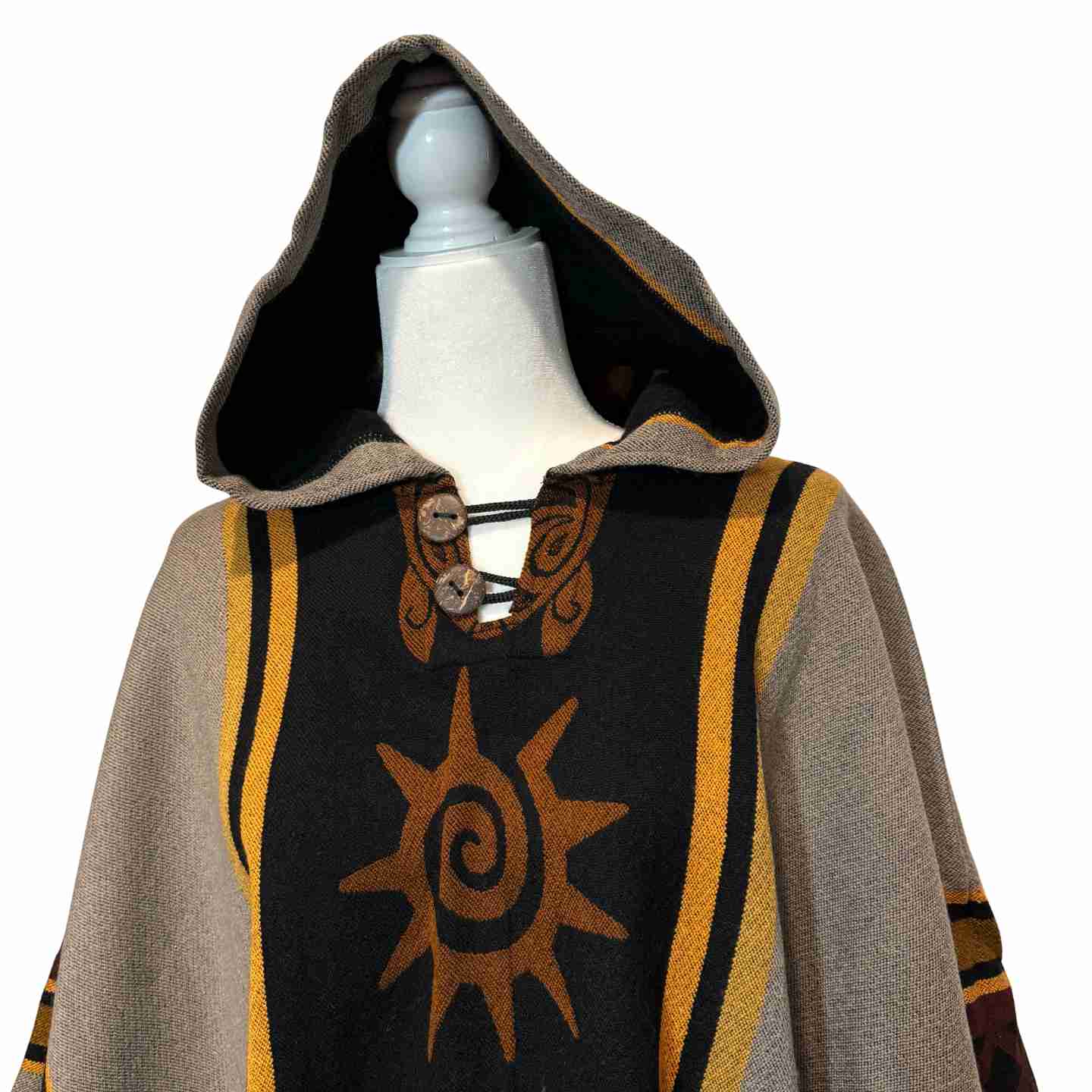 Four Directions Nightfall hooded alpaca-blend poncho in taupe and black, front view with sun and four-directions motif