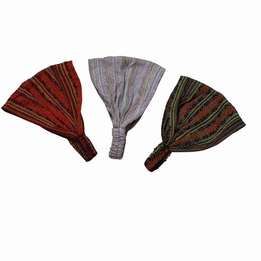 Three headbands with striped patterns on a white background